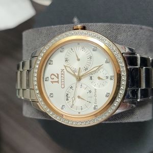 Citizen Women's Eco-Drive Silver and Rose Gold Chronograph watch.